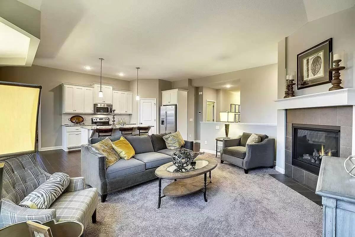 Living Room with Seamless Kitchen Connection and a Striking Fireplace