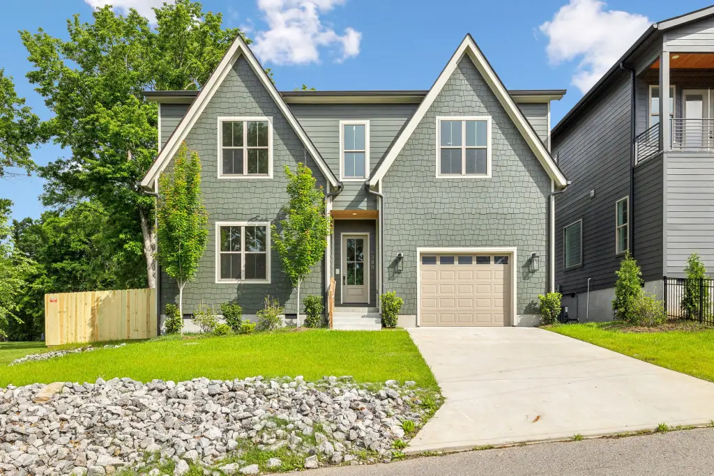 Contemporary 4-Bedroom Tudor Home with Open-Concept Layout and Two-Story Foyer (2,750 Sq. Ft. Floor Plan)