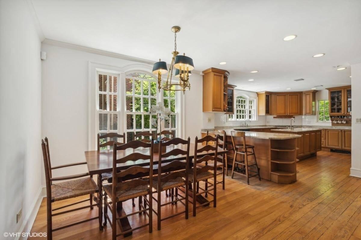 Spacious Kitchen and Dining with Large Windows and Warm Wood Finishes