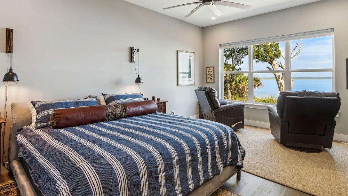 Rest Easy in This Bedroom with Floor-to-Ceiling Water Views