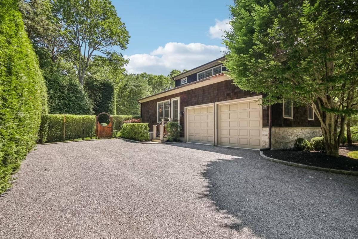 Quiet Entry with Double Garage Amidst Lush Greenery