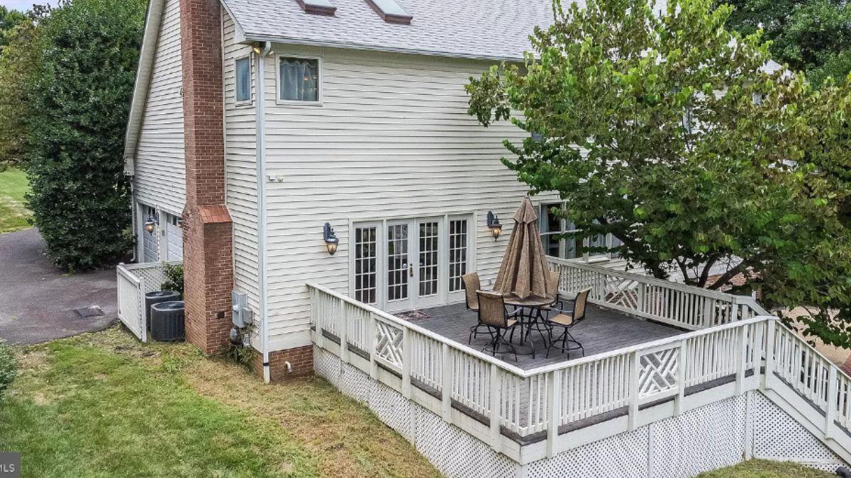 Step Onto the Spacious Deck with Its Striking Brick Chimney
