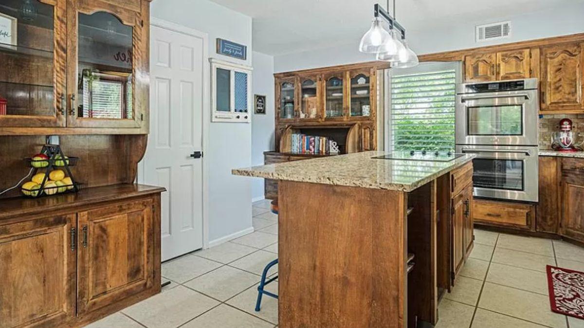 Charming Kitchen with Rustic Cabinetry and Central Island