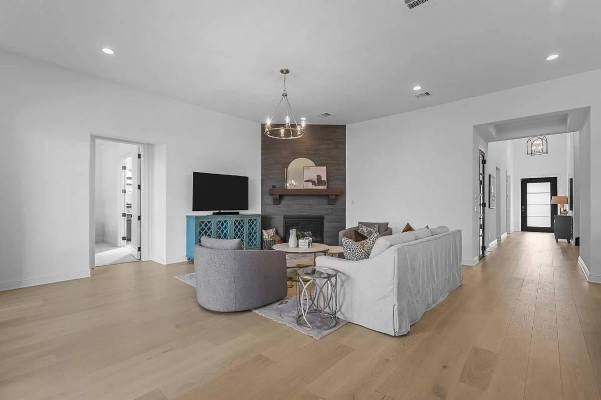 Look at That Charcoal-Backed Fireplace in This Modern Living Room