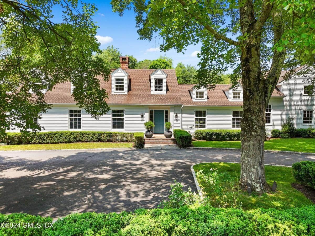 Charming Colonial Facade with Dormer Windows and Classic Symmetry