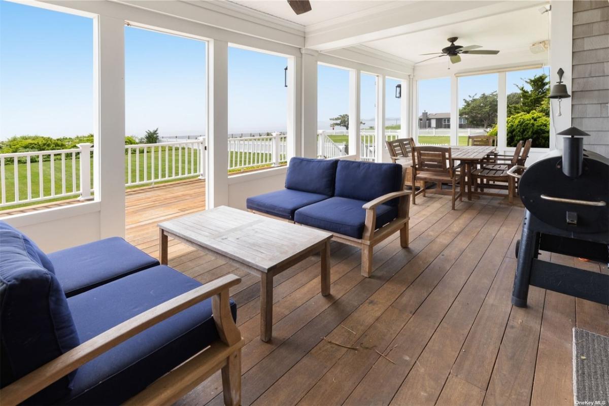 Relax on This Screened Porch with Ocean Breezes and a Grilling Station