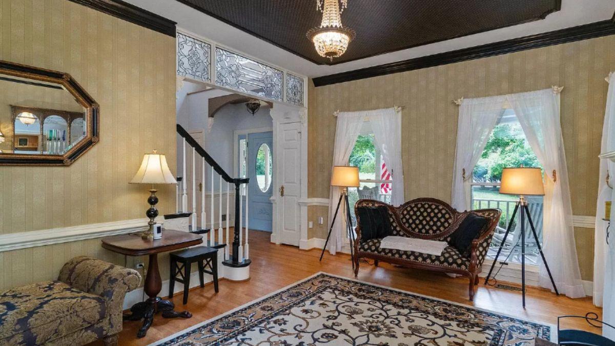 Step Into This Elegant Living Room with Intricate Stained Glass Details