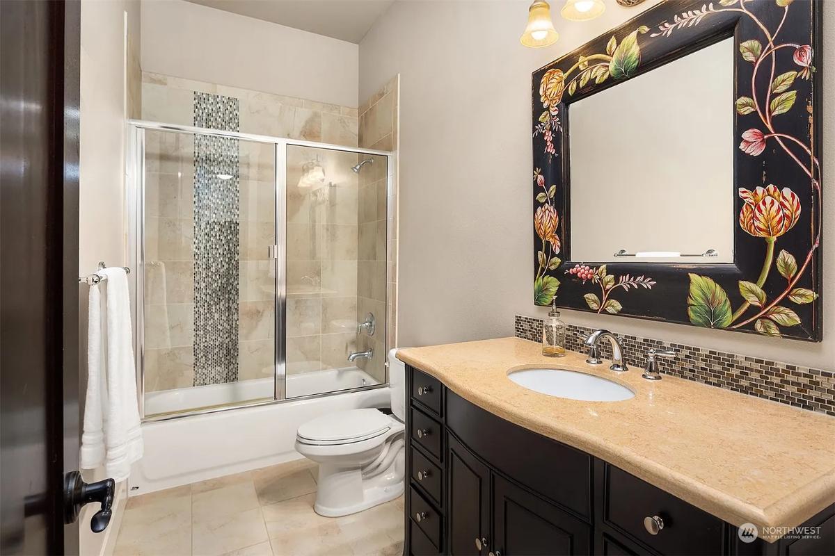 Spot the Floral Mirror Frame Adding Character in the Bathroom