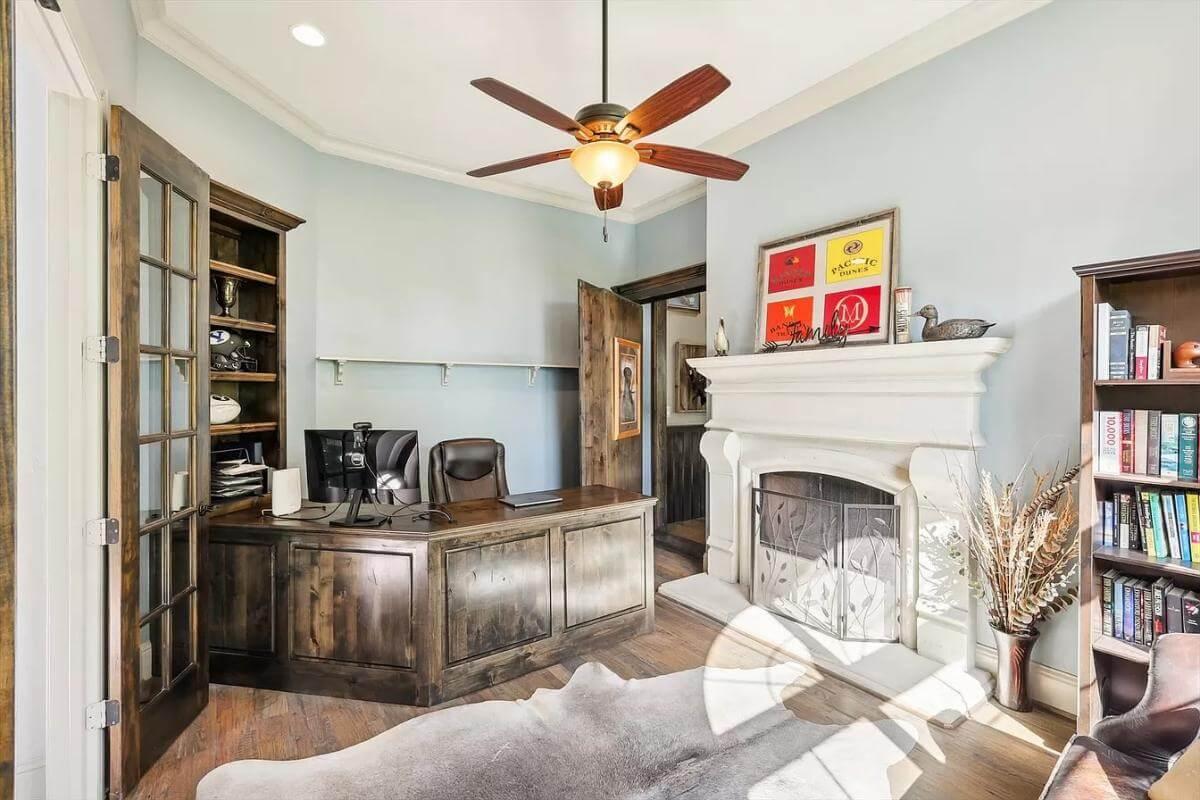 Check Out This Home Office with Elegant Fireplace and Classic Wood Features