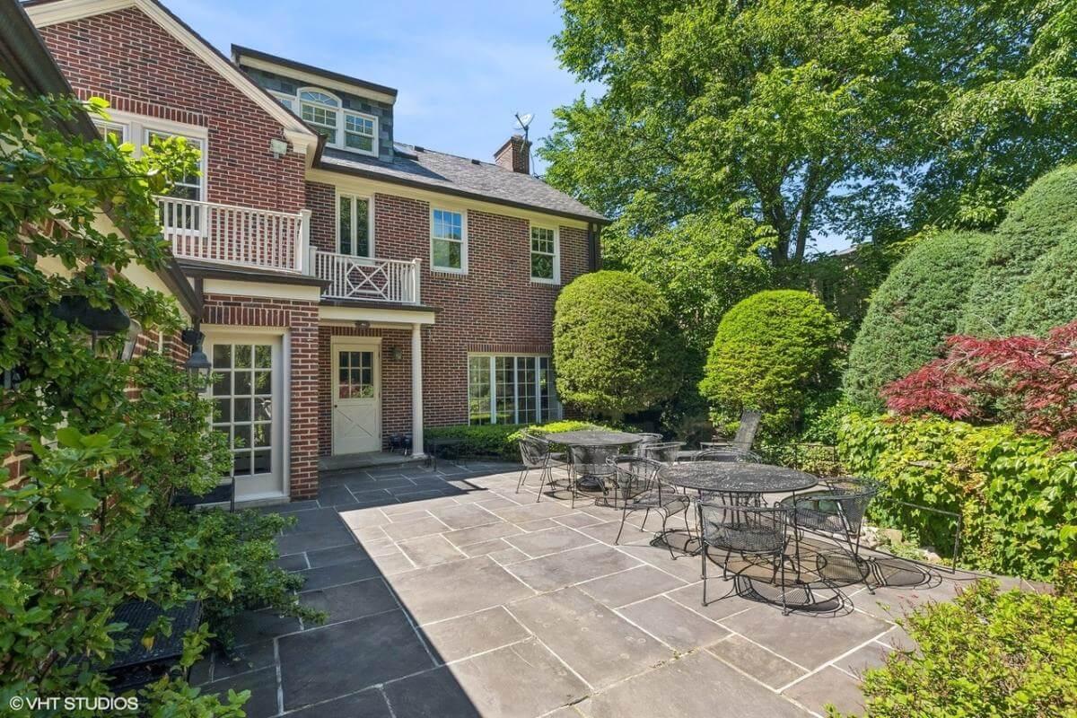 Charming Courtyard with Classic Brick and Lush Greenery