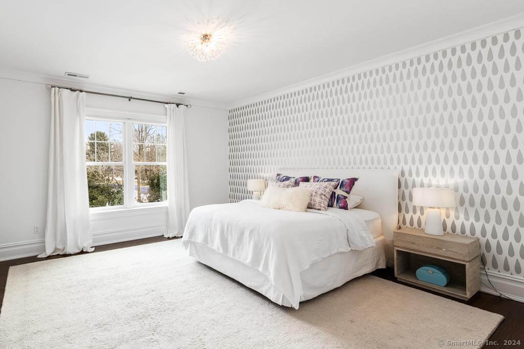 Peaceful Bedroom with Eye-Catching Geometric Accent Wall