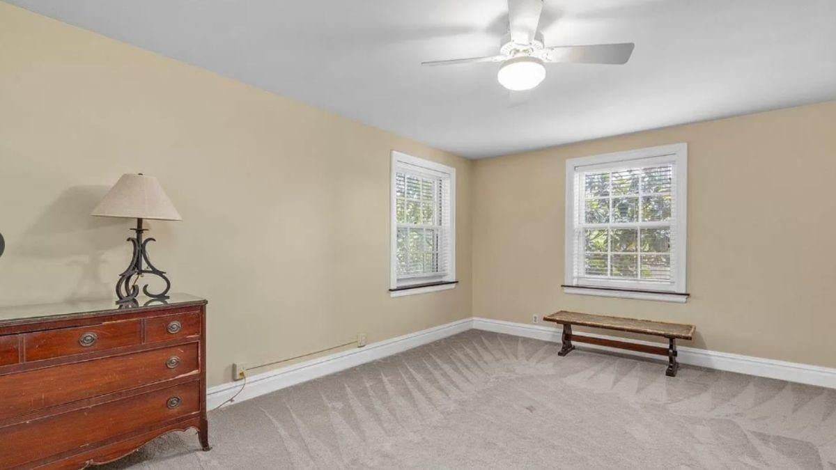 Simple Bedroom with Rich Wood Accents and Natural Light