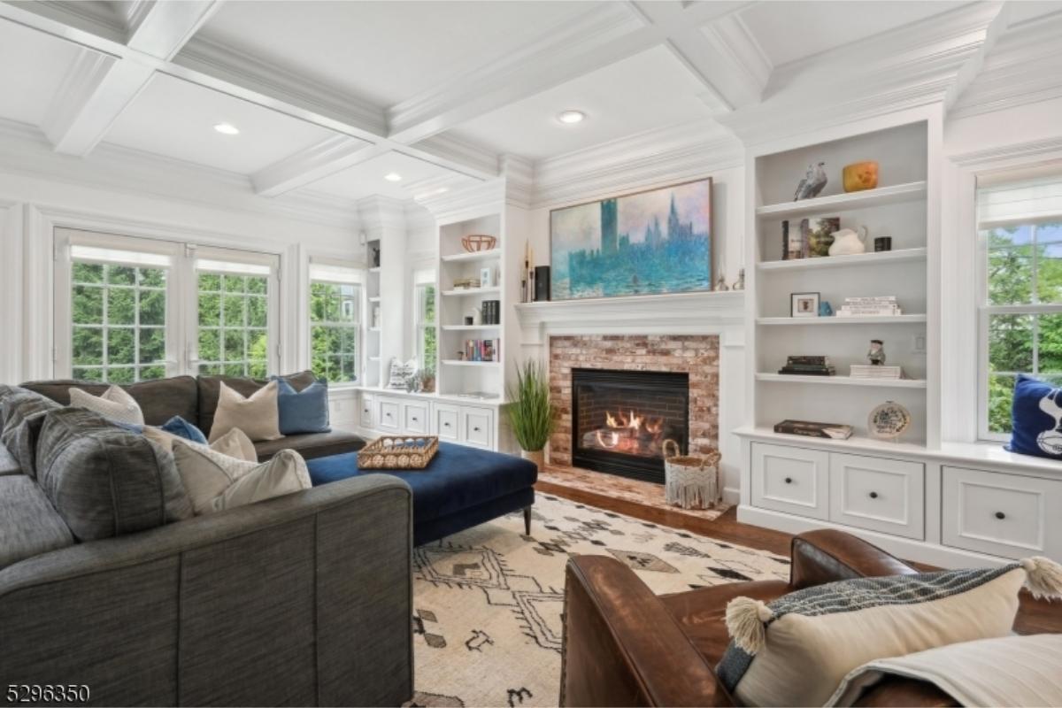 Cozy Living Room with Brick Fireplace and Built-in Shelving
