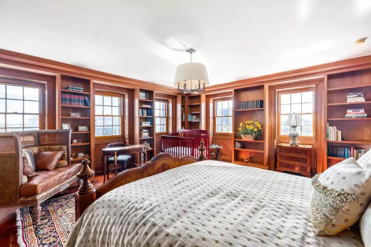 Cozy Bedroom Library with Rich Wood Built-Ins and Timeless Charm