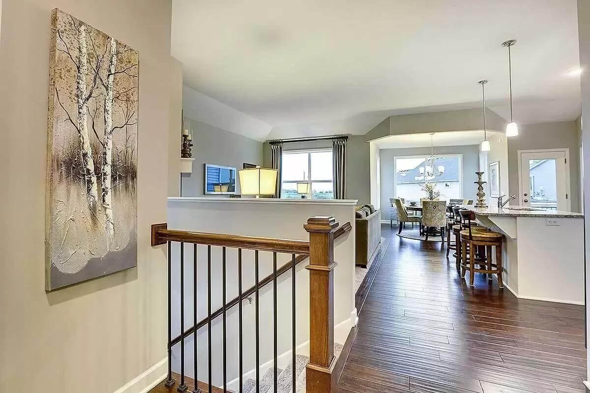 Notice the Flow from Dining to Living Area with Hardwood Underfoot