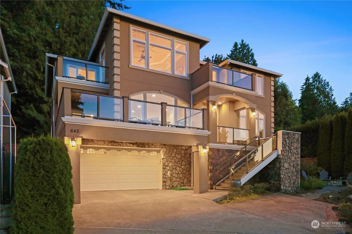Modern Elegance with Striking Glass Balconies and Stone Accents
