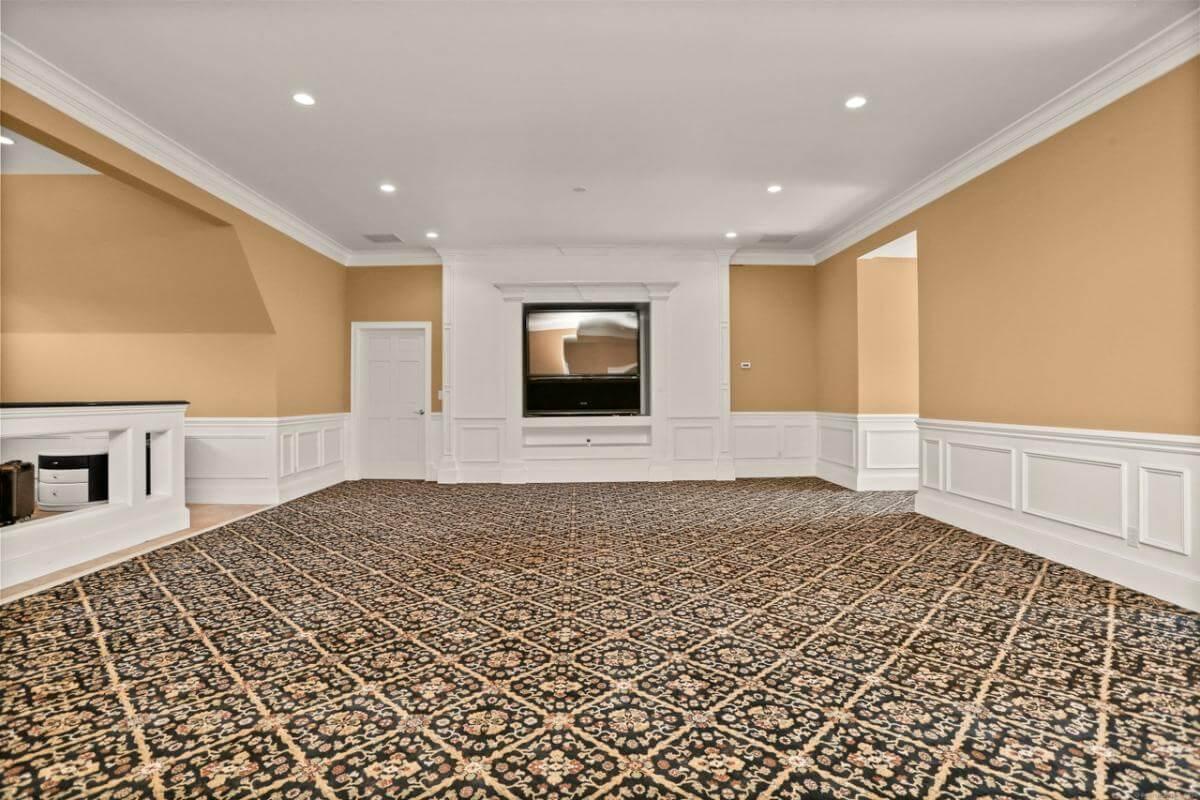 Basement Recreation Room with Traditional Wainscoting and Built-In TV