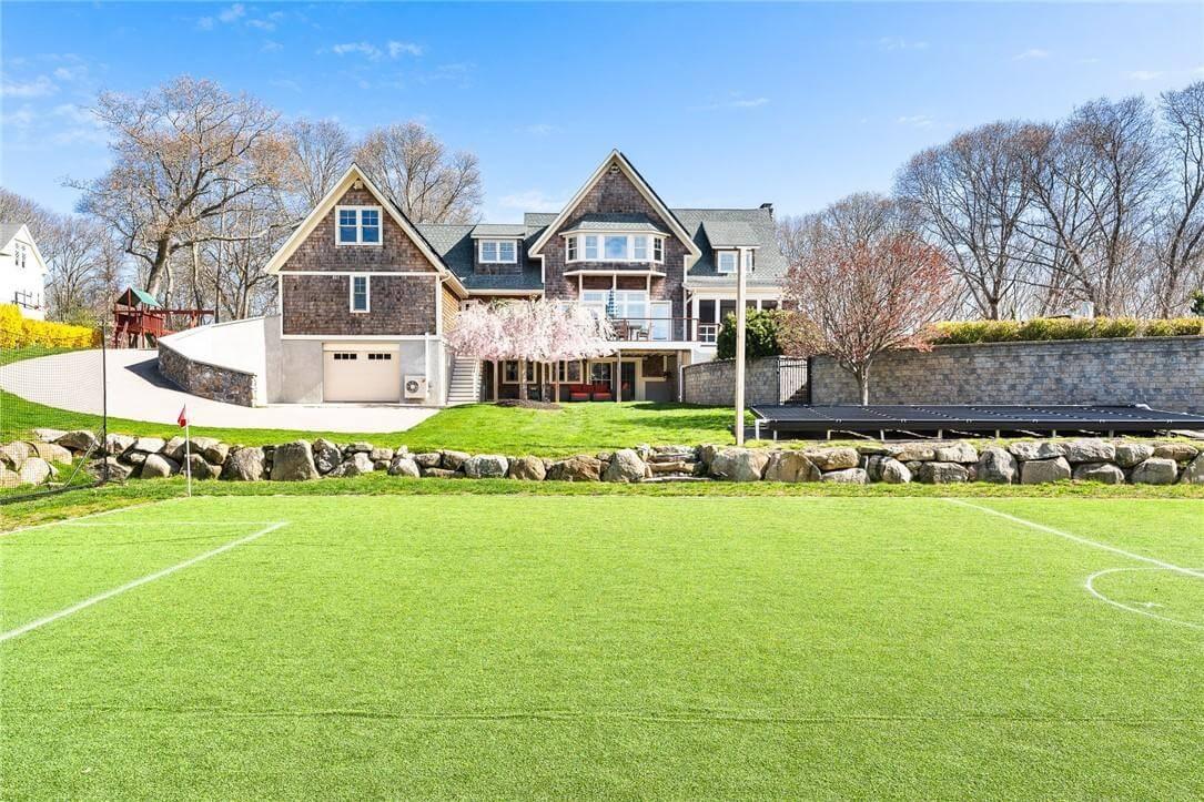 Explore the Expansive Backyard Complete with a Private Sports Field