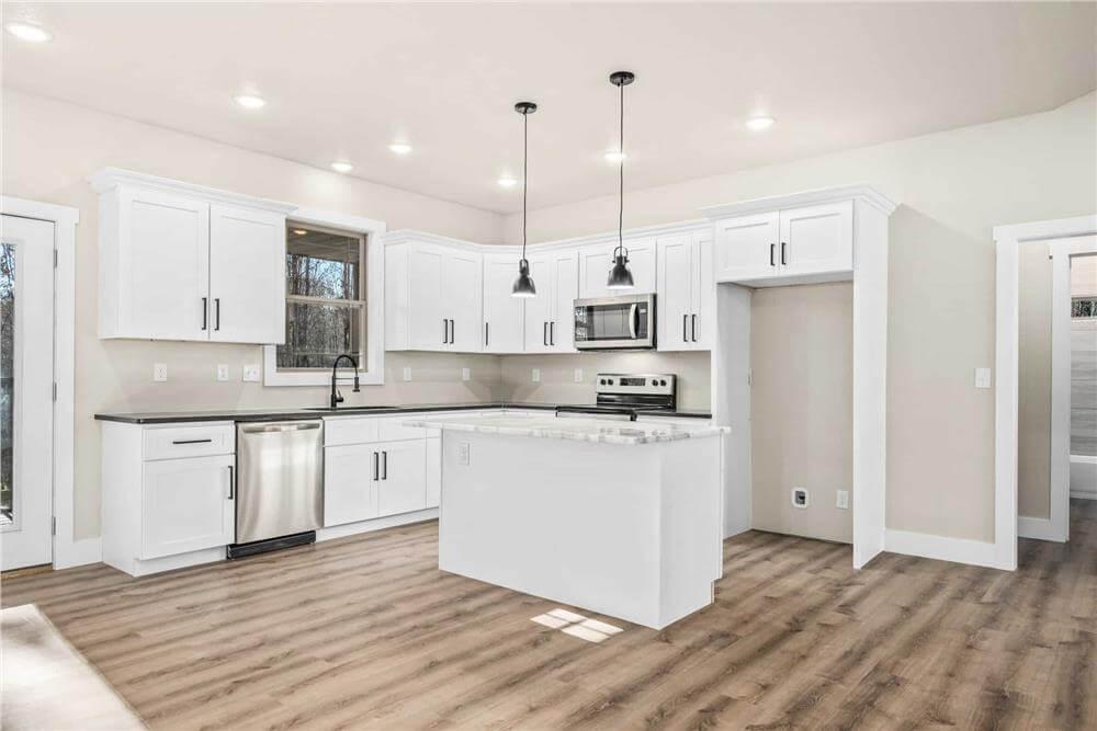 Modern Simplicity: Sleek White Cabinets Define This Kitchen