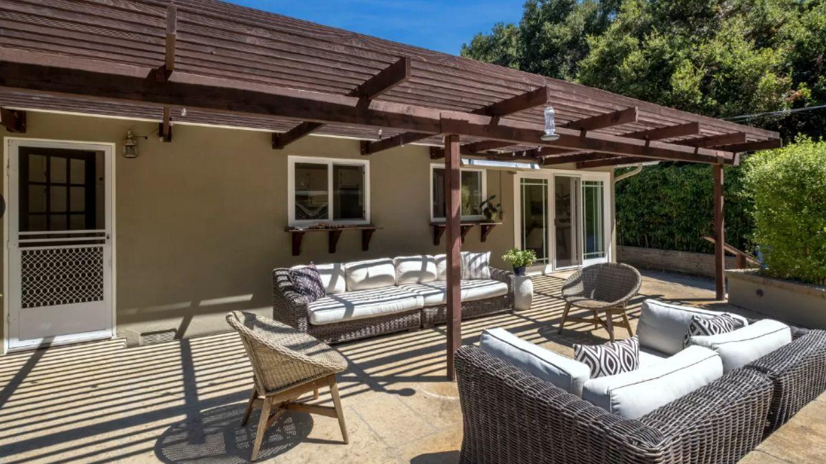 Check Out This Patio with a Stylish Wooden Trellis
