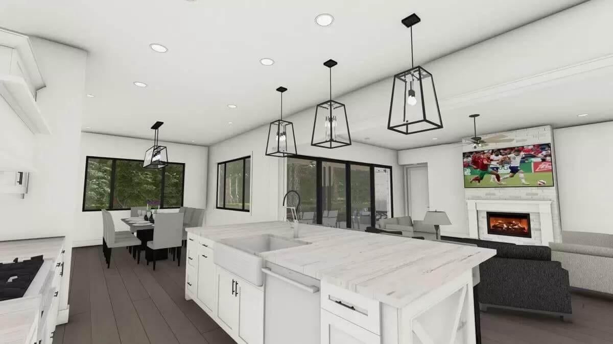 Enjoy the Expansive Island and Contemporary Light Fixtures in This Open-Concept Space