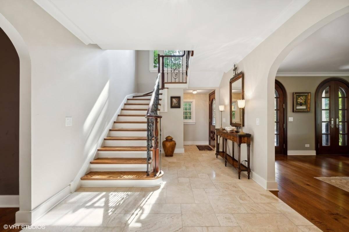 Wow, Look at the Elegant Staircase in This Sunlit Foyer