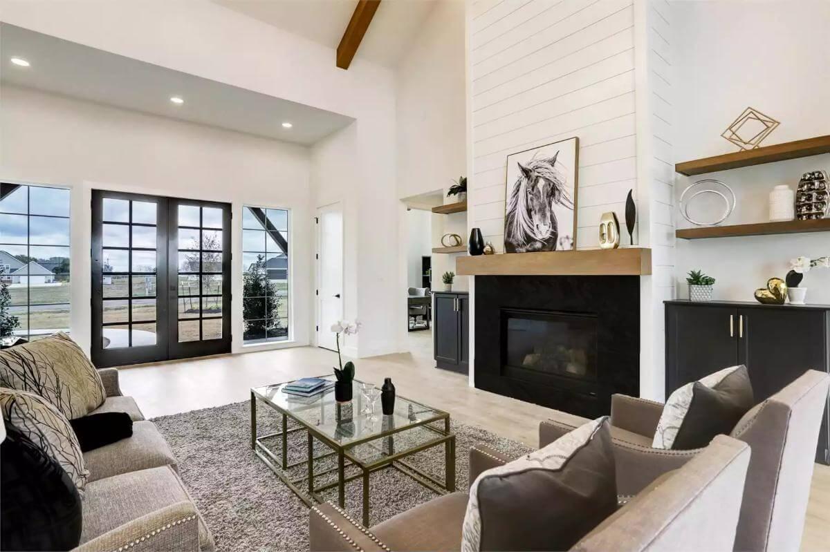 Sleek Living Room with Shiplap Fireplace and Stunning Views