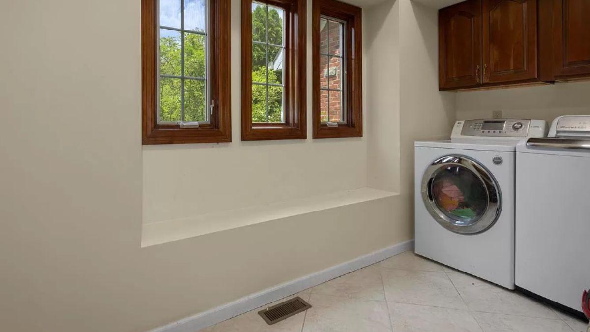 Laundry Room with a View and Functional Built-In Bench