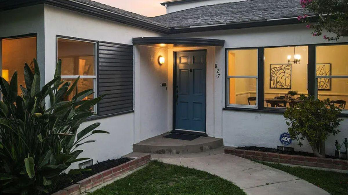 Consider the Warm Glow from Inside This Stylish Entryway