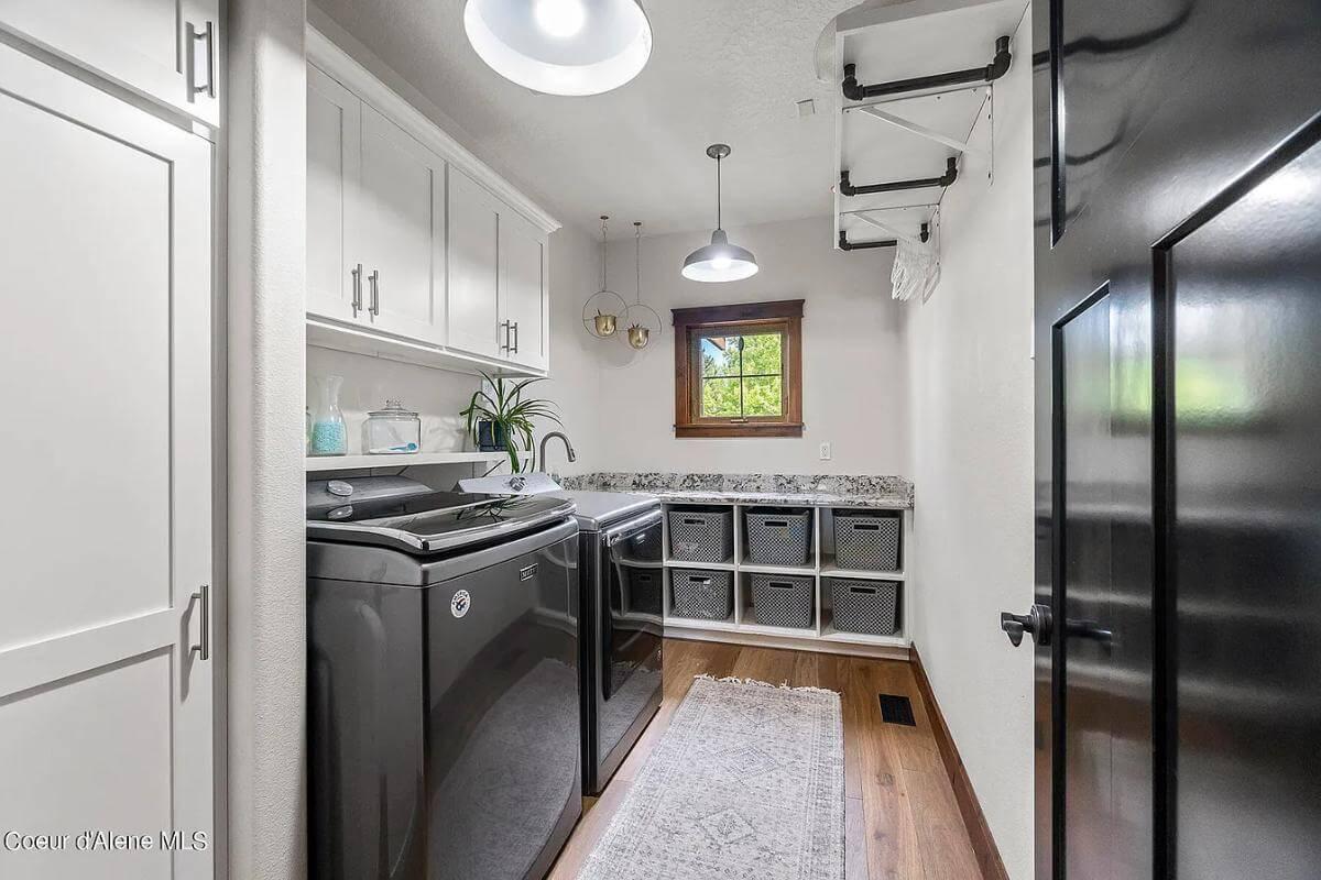Step Into This Well-Organized Laundry Room with Handy Storage Cubbies