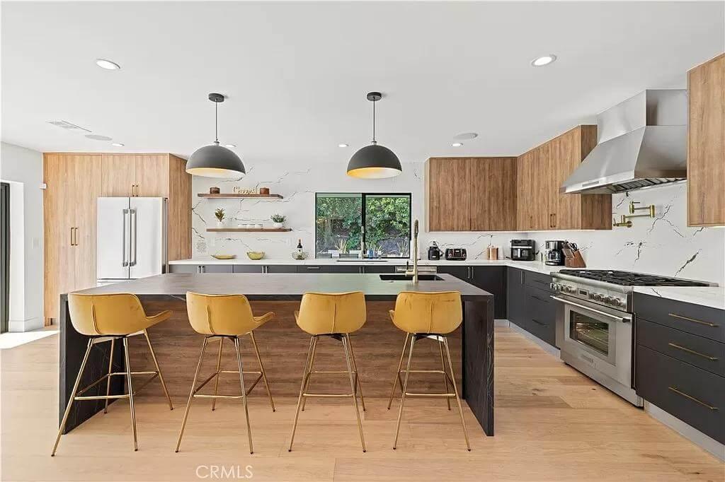 Check Out the Industrial Pendants Highlighting This Sleek Kitchen