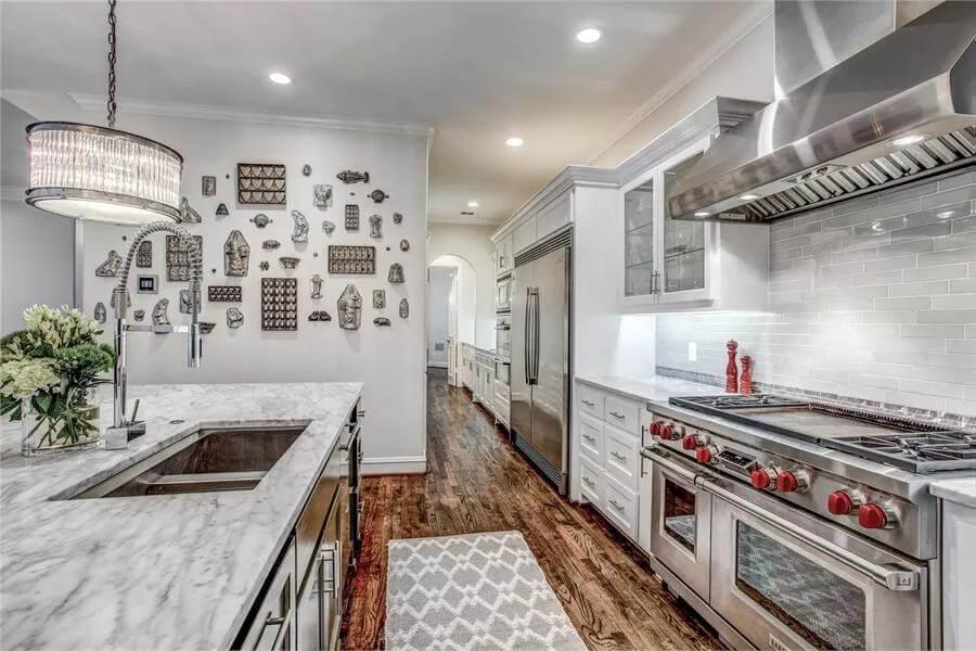 Marble Island and Artful Backdrop in a Modern Kitchen