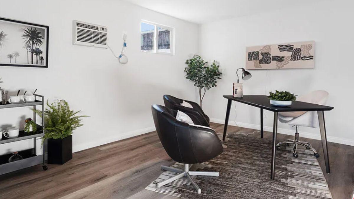 Notice the Sleek Black Furniture in This Modern Office Space