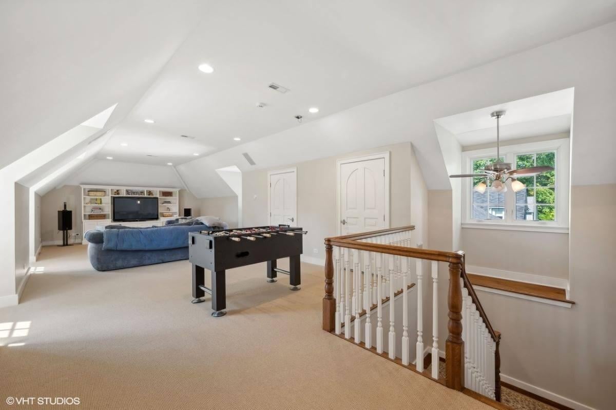 Spacious Game Room Loft with Natural Light and Entertainment Nooks