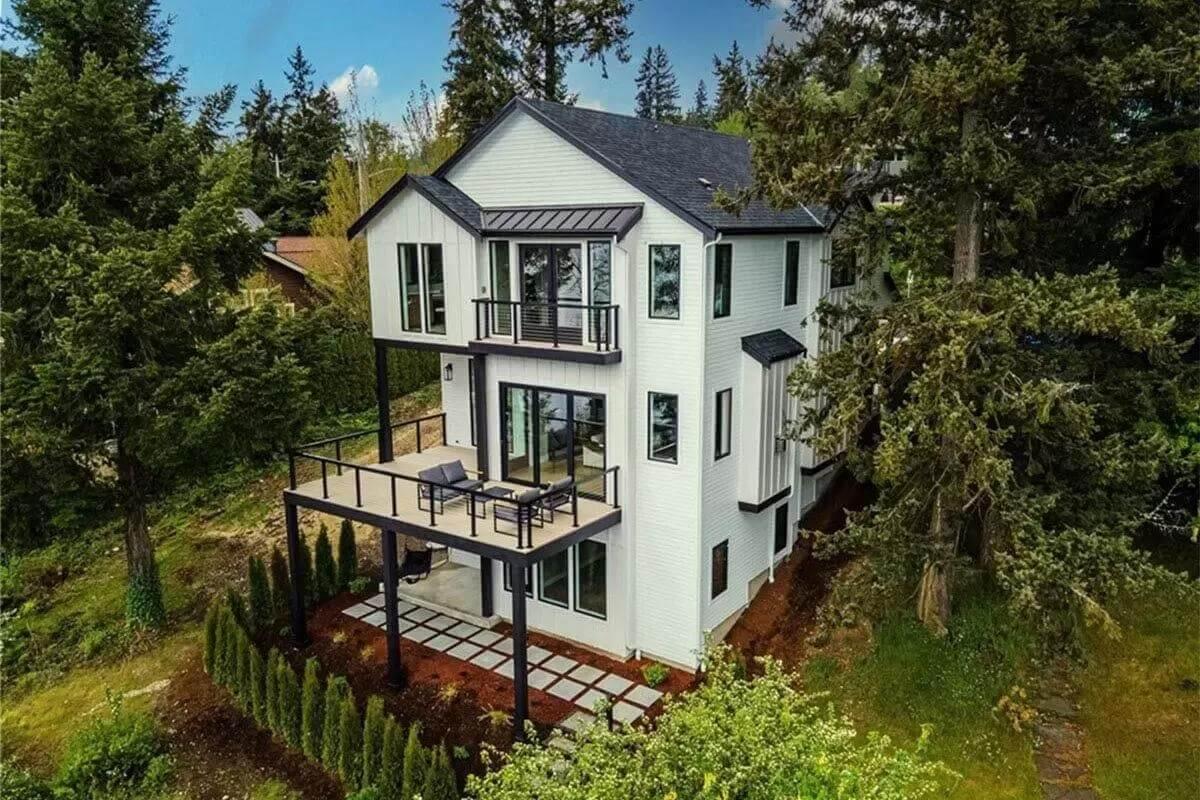 Take In the Expansive Deck and Vertical Siding on This Contemporary Home