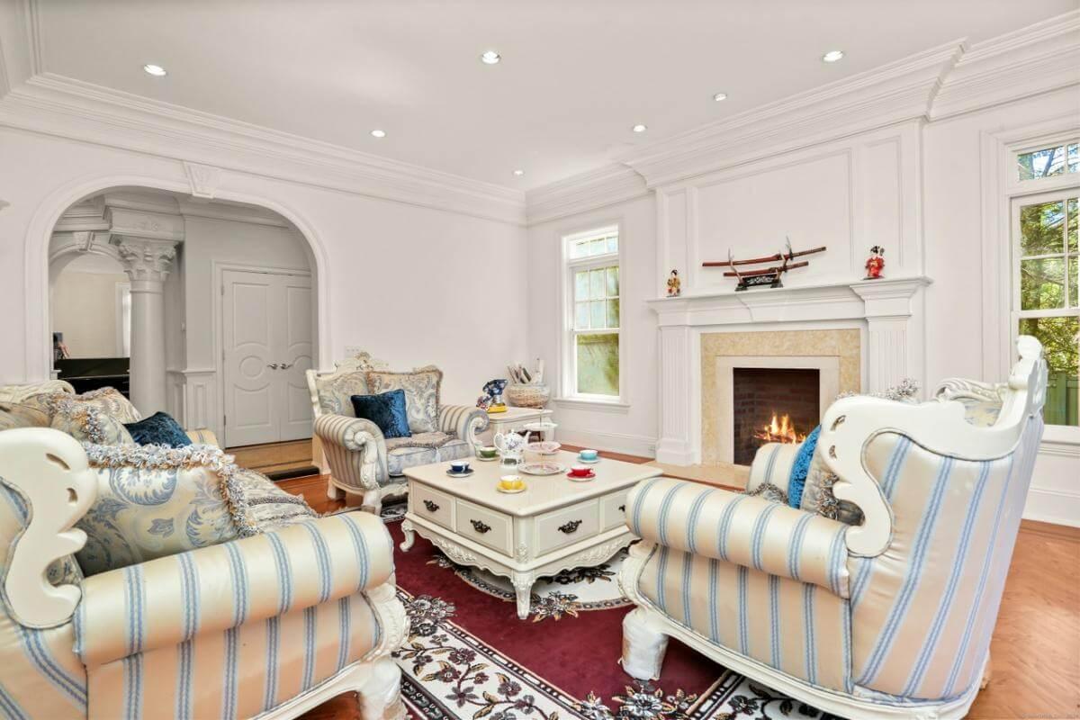 Step into This Elegant Living Room with Classic Upholstery and a Cozy Hearth