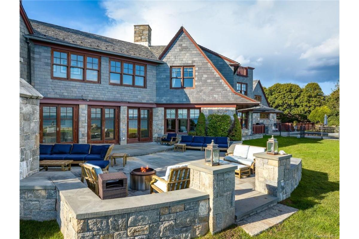 Step Outside to This Expansive Stone Patio with Ocean Views