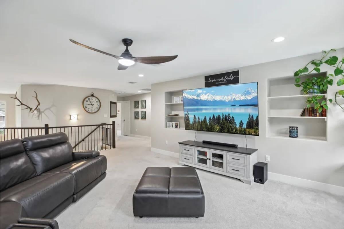 Relax in the Media Loft with Built-In Shelving and Modern Decor