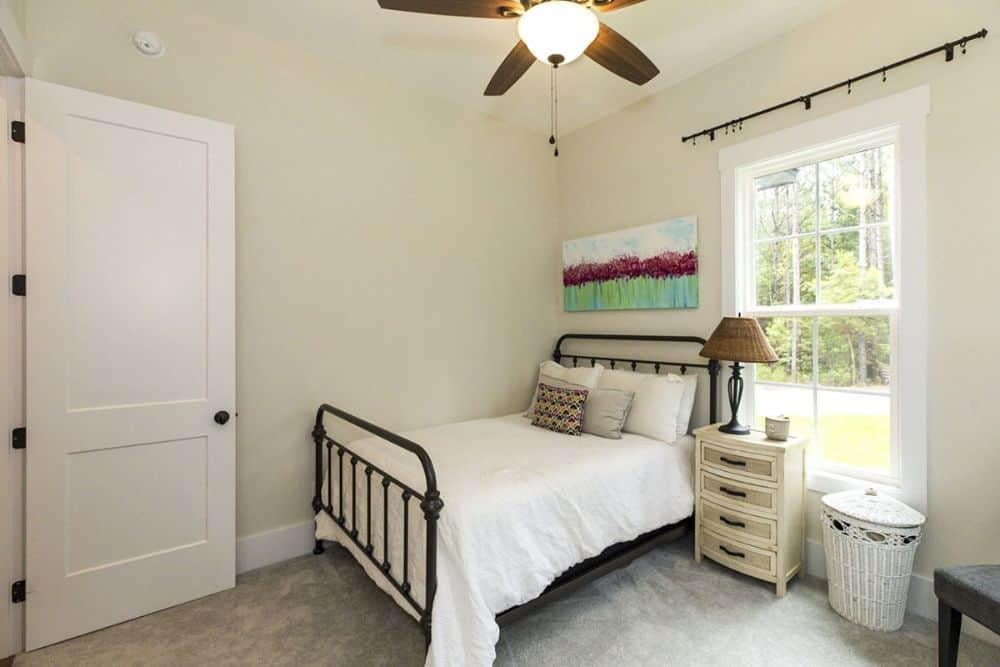 Small Craftsman Bedroom with Charming Iron Bedframe