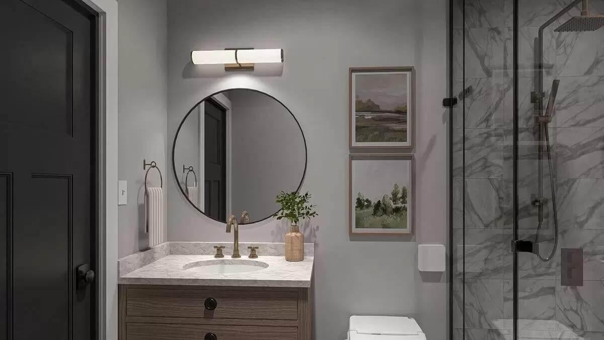 Notice the Subtle Elegance of the Marble Shower and Circular Mirror
