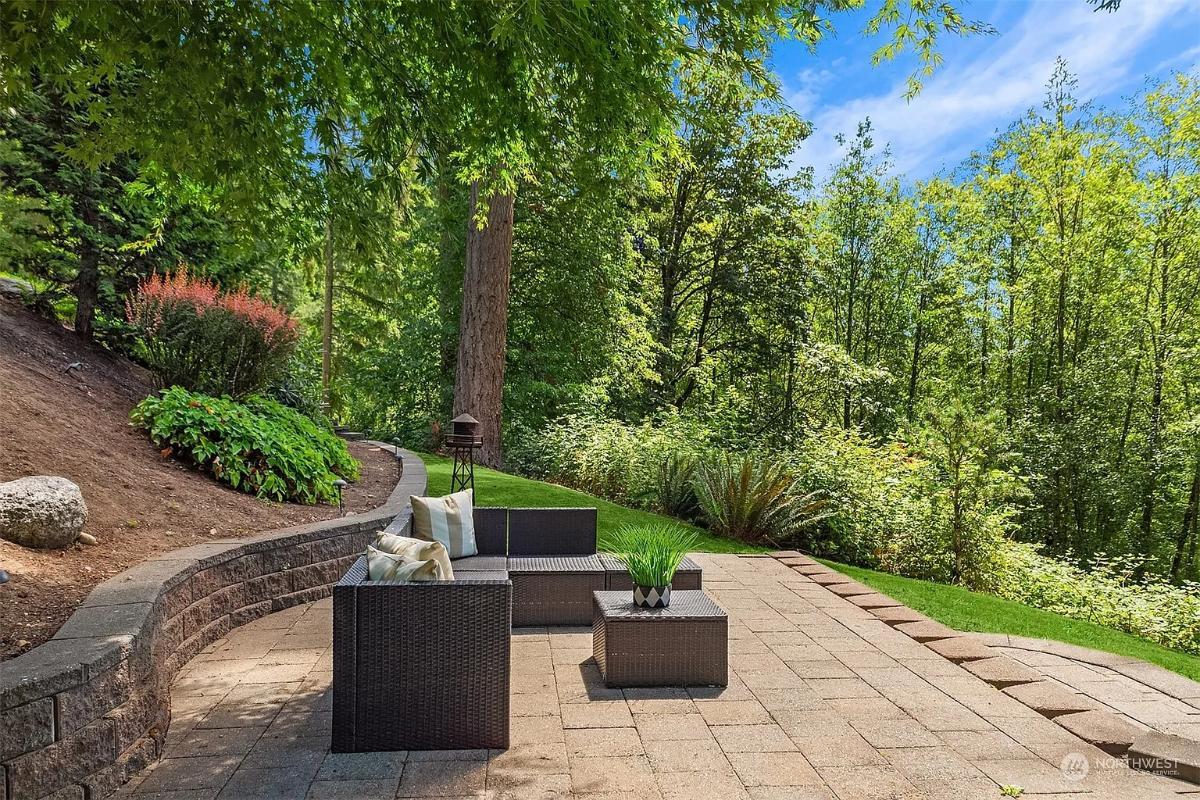 Enjoy Nature on This Craftsman Patio with a Forest Backdrop