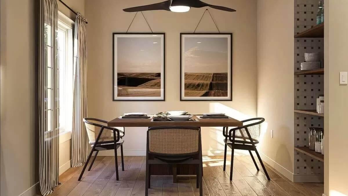 Dining Room with Rattan Chairs and Striking Landscape Prints
