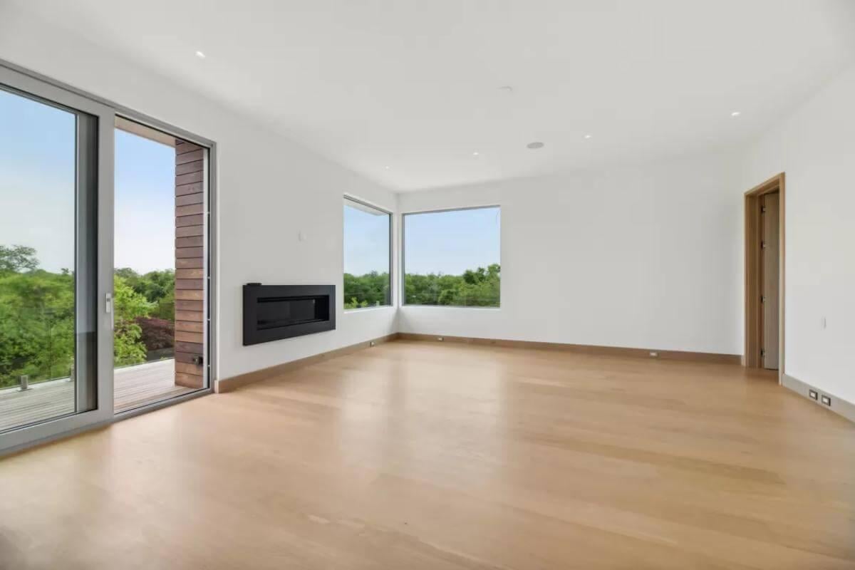 Minimalist Living Room with Sleek Fireplace and Expansive Views
