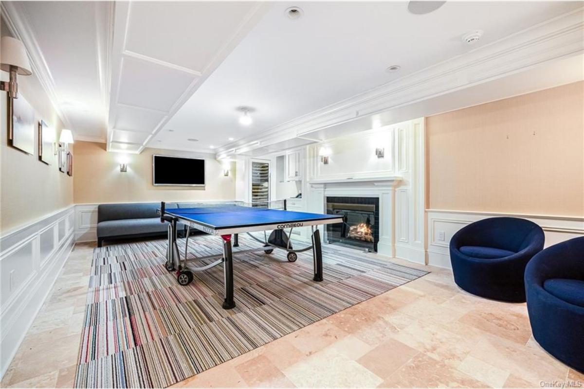 Game Room with a Fireplace and Modern Touches