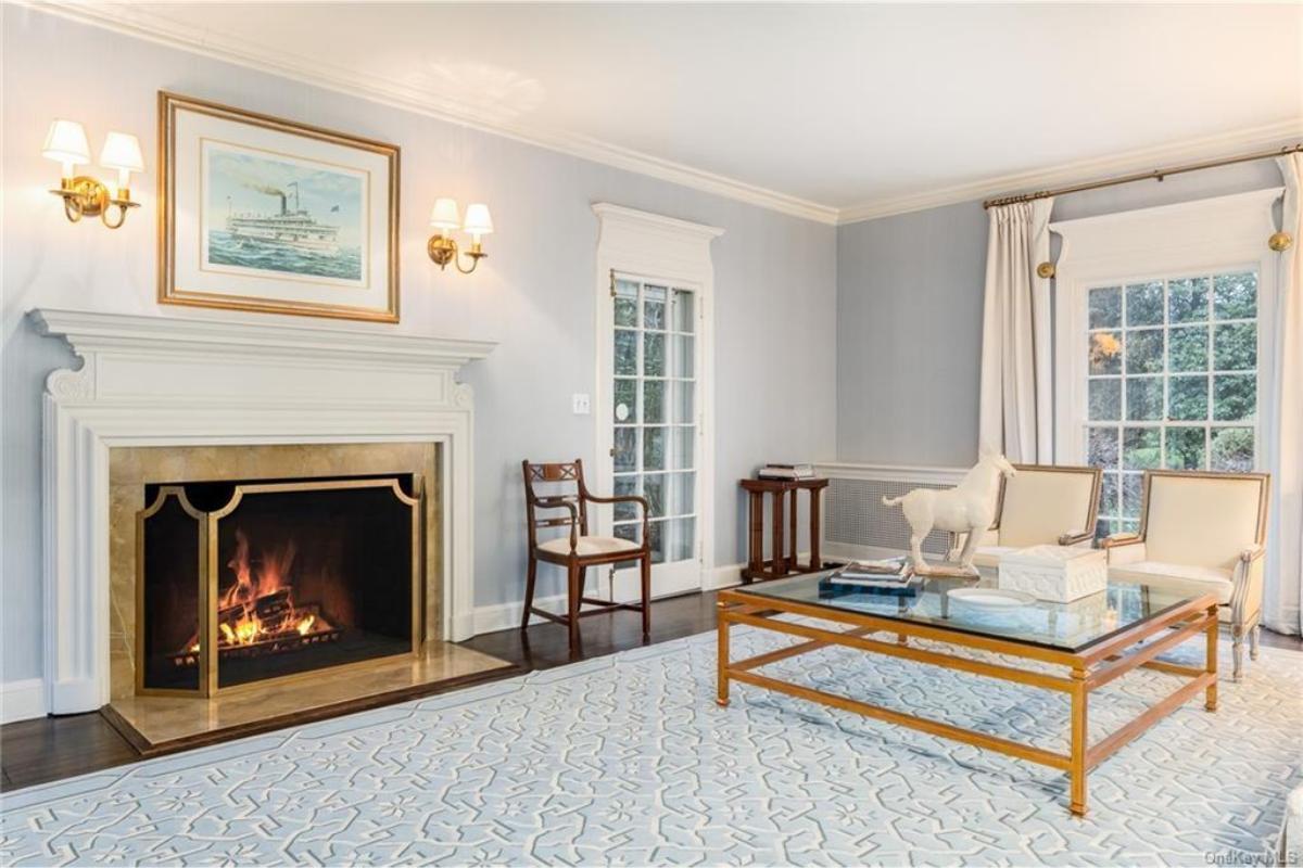 Elegant Living Room with a Classic Mantel and French Doors