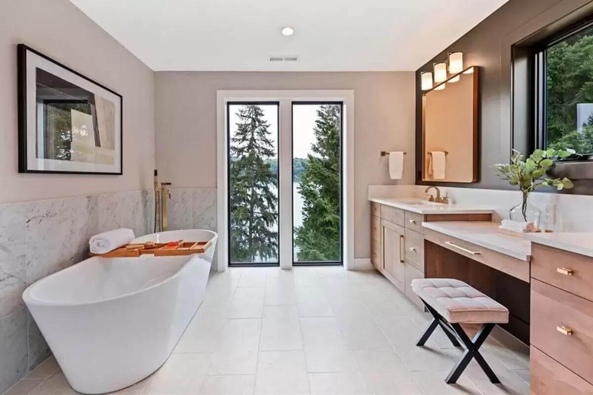Take in the Freestanding Tub with a View in This Serene Bathroom