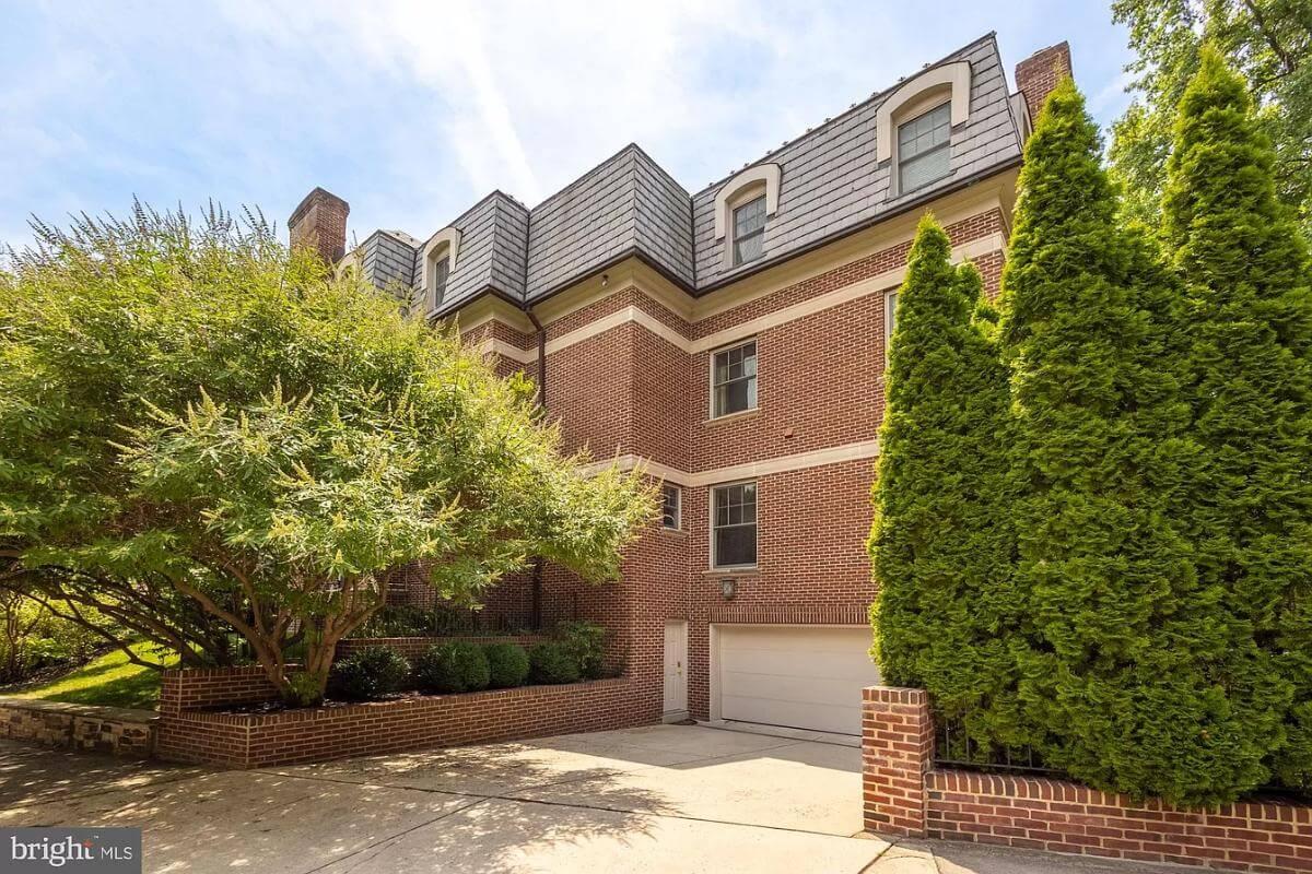 Check Out the Mansard Roof and Classic Brick Detailing on This Home
