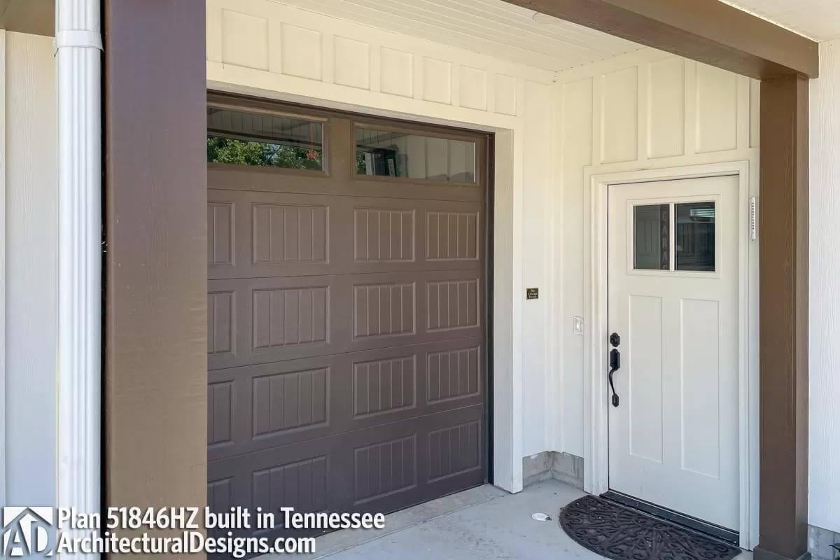 Notice the Thoughtful Contrast Between the Dark Garage Door and Light Entryway