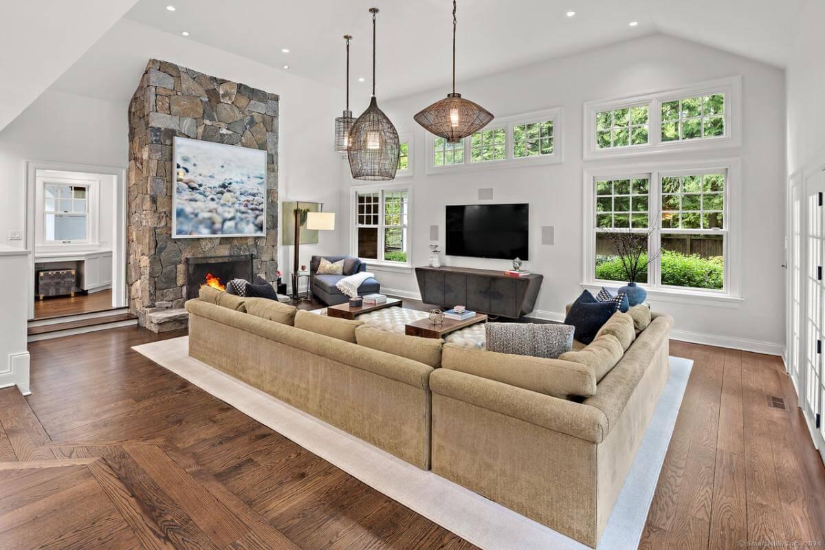 Admire the Expansive Sectional in This Family Room with a Natural Stone Fireplace
