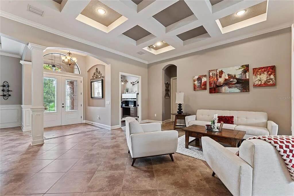 Wow, Look at the Intricate Coffered Ceiling in This Elegant Living Space